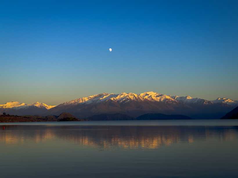 The sun rising over Lake Wānaka, on my way to the coffee shop